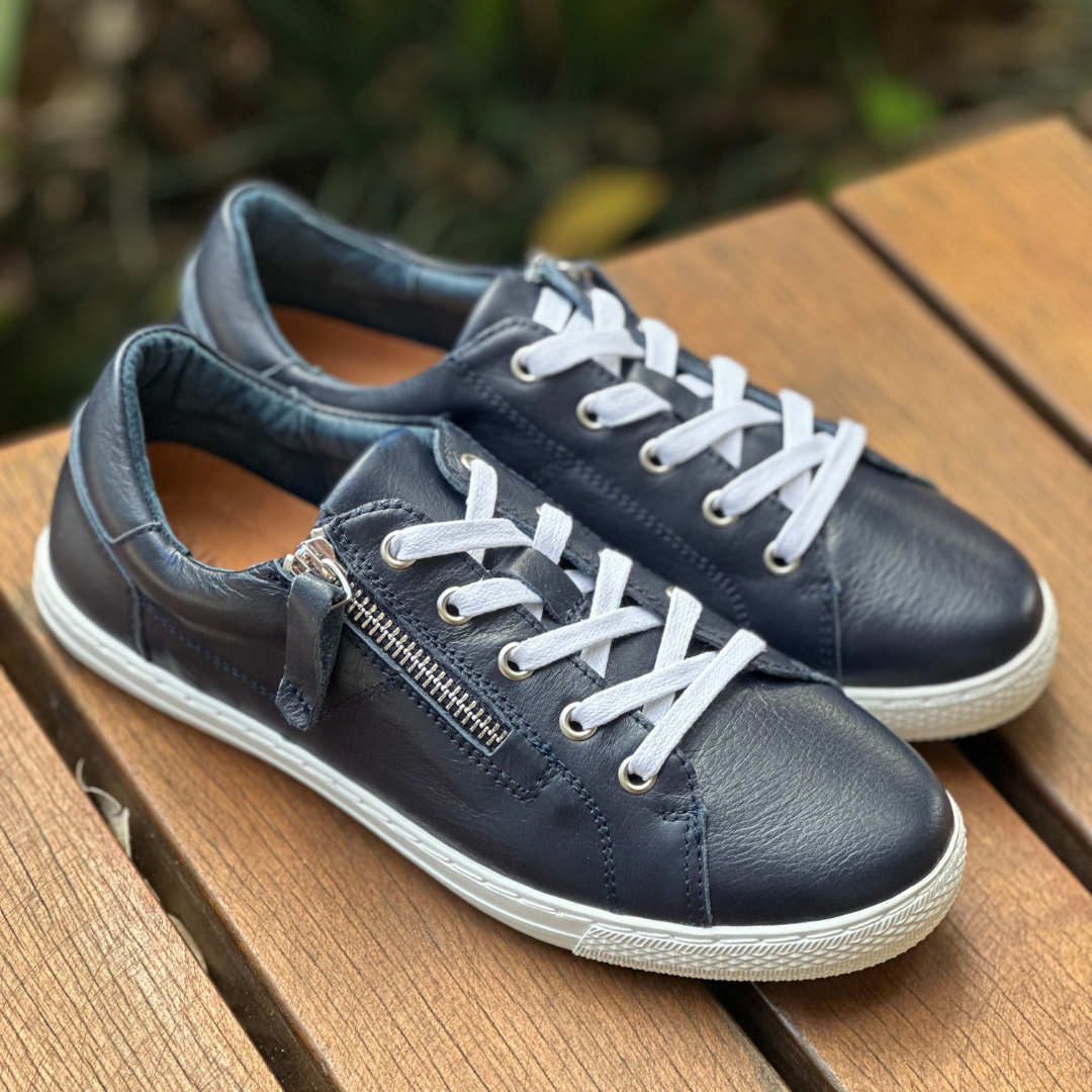 Navy sneakers with side zip and white lace white soles