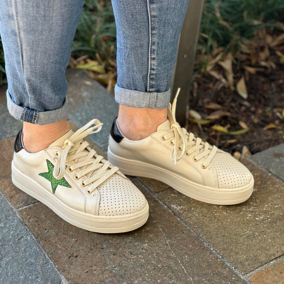 cream sneakers with green star
