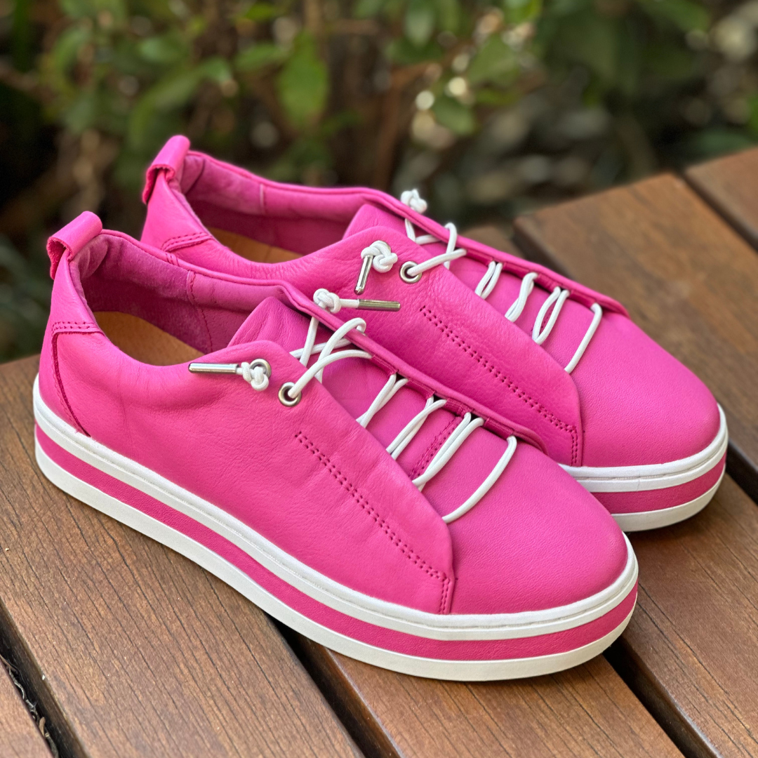 pink -sneakers with white soles and white elastic laces