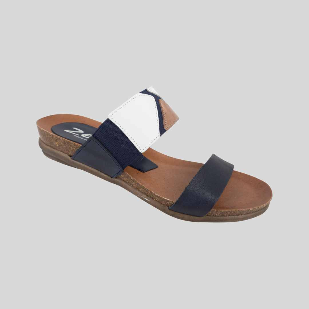 navy slip on slides with tan and white trim. Elastci gusset in top strap for ease of putting on