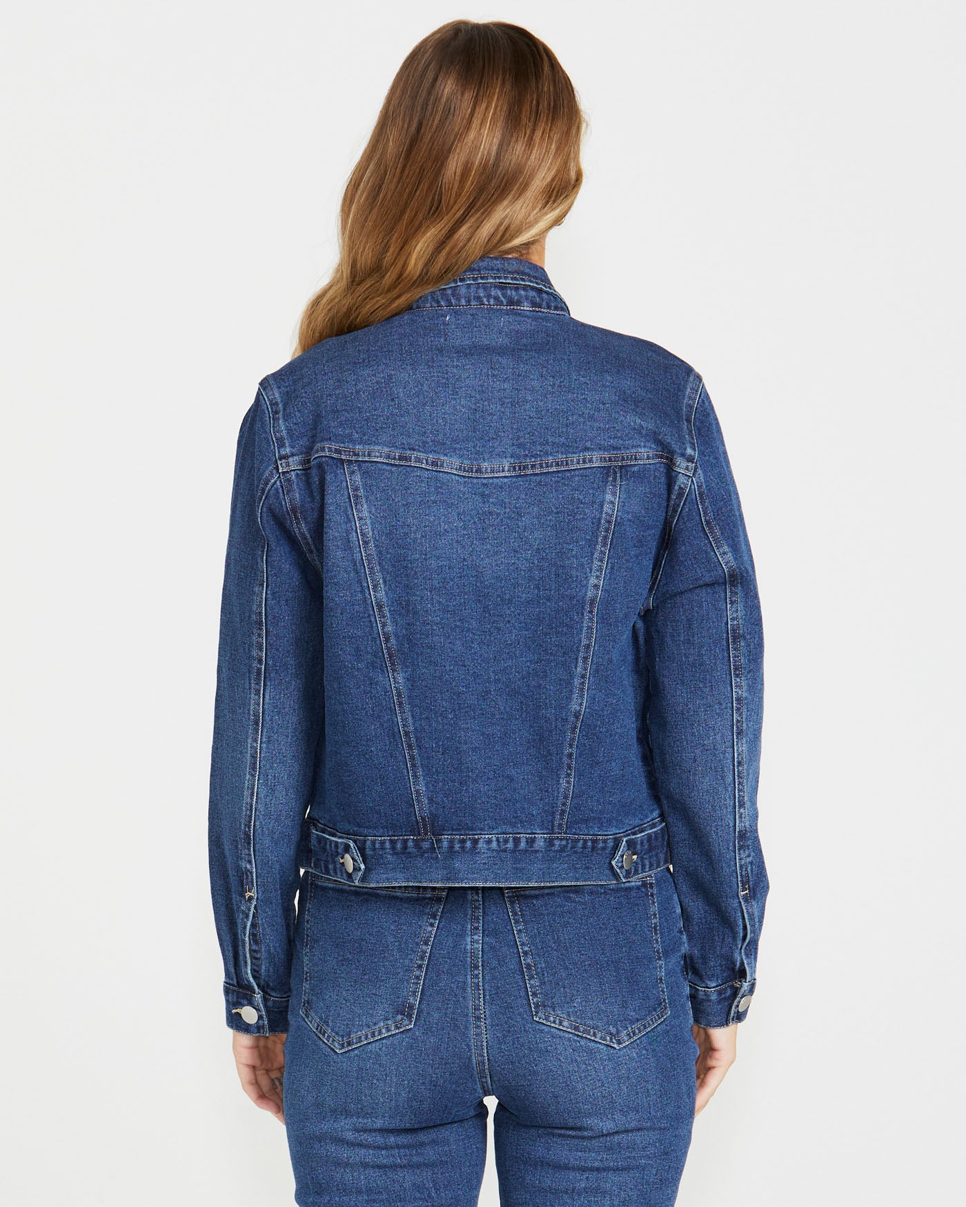 back of a dark denim jacket by sass clothing