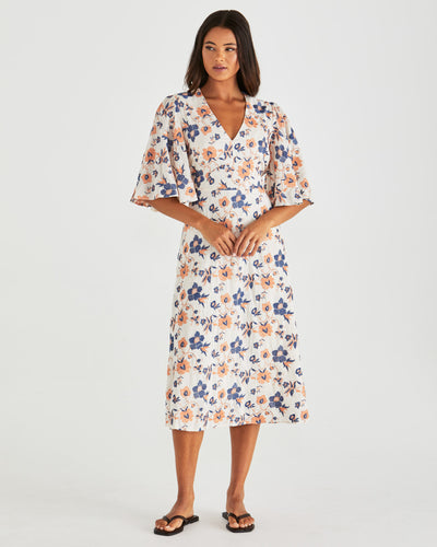Woman wearing a floral dress on a white background