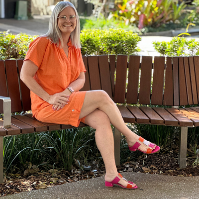 pink and orange patent slides