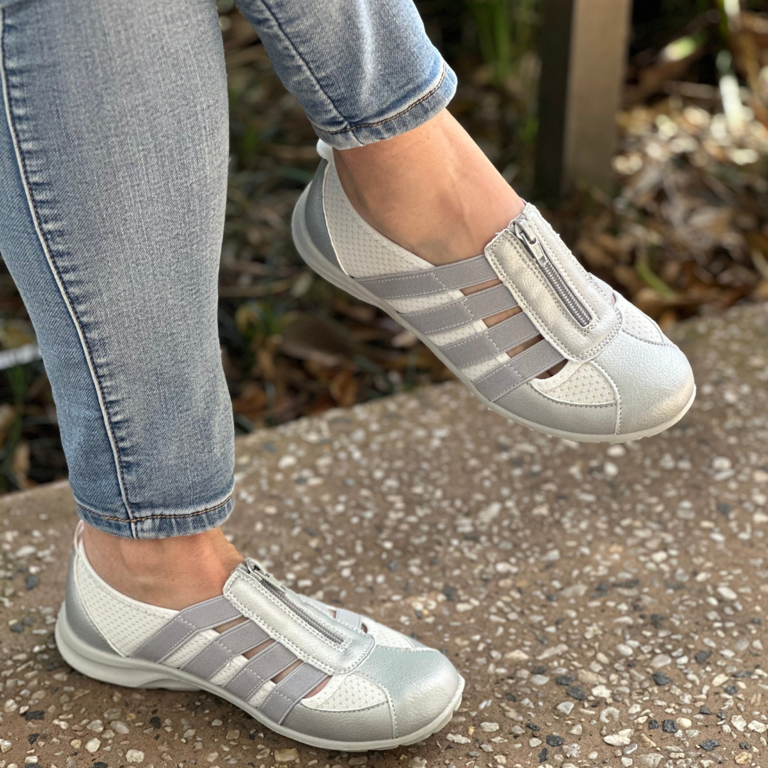 cc resorts slip on casual shoes with a zip up the front in silver abd white 