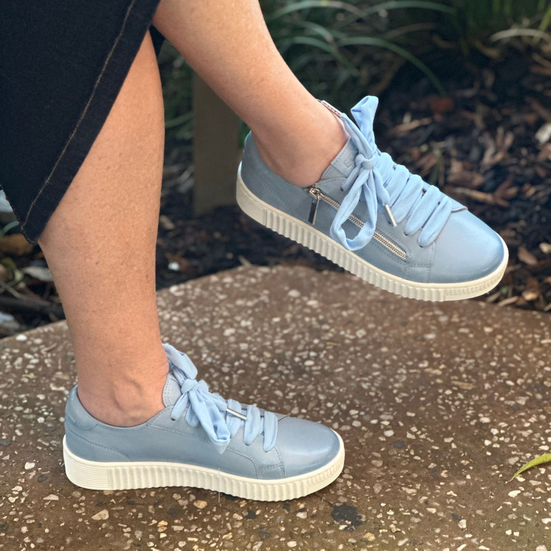 pale blue sneaker with wide shoe lace and side zip 