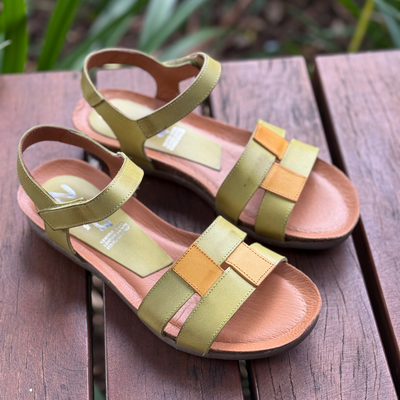 green sandals with yellow trim 