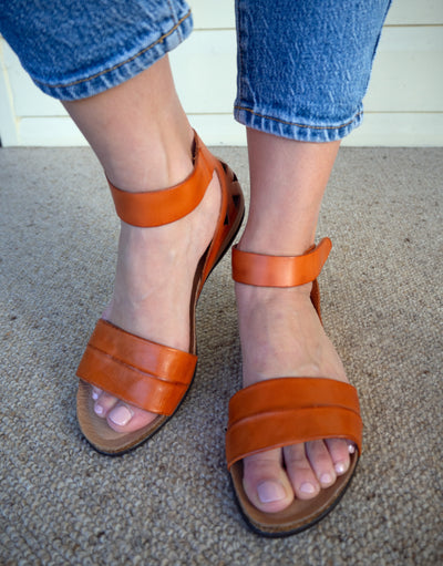 Zeta Palin in Naranja orange soft leather uppers with adjustable velcro straps around the heel