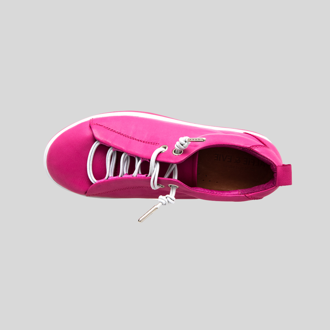 hot pink sneakers with contrasting white elastic lace and white soles