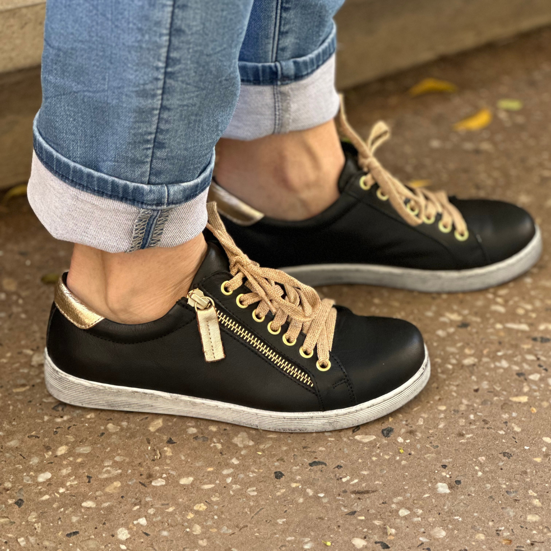 Rilassare token sneakers with gold trim and laces