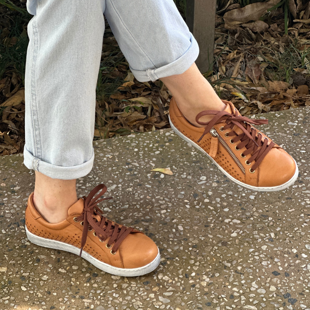 tan lace up soft sneakers with perferated sides 