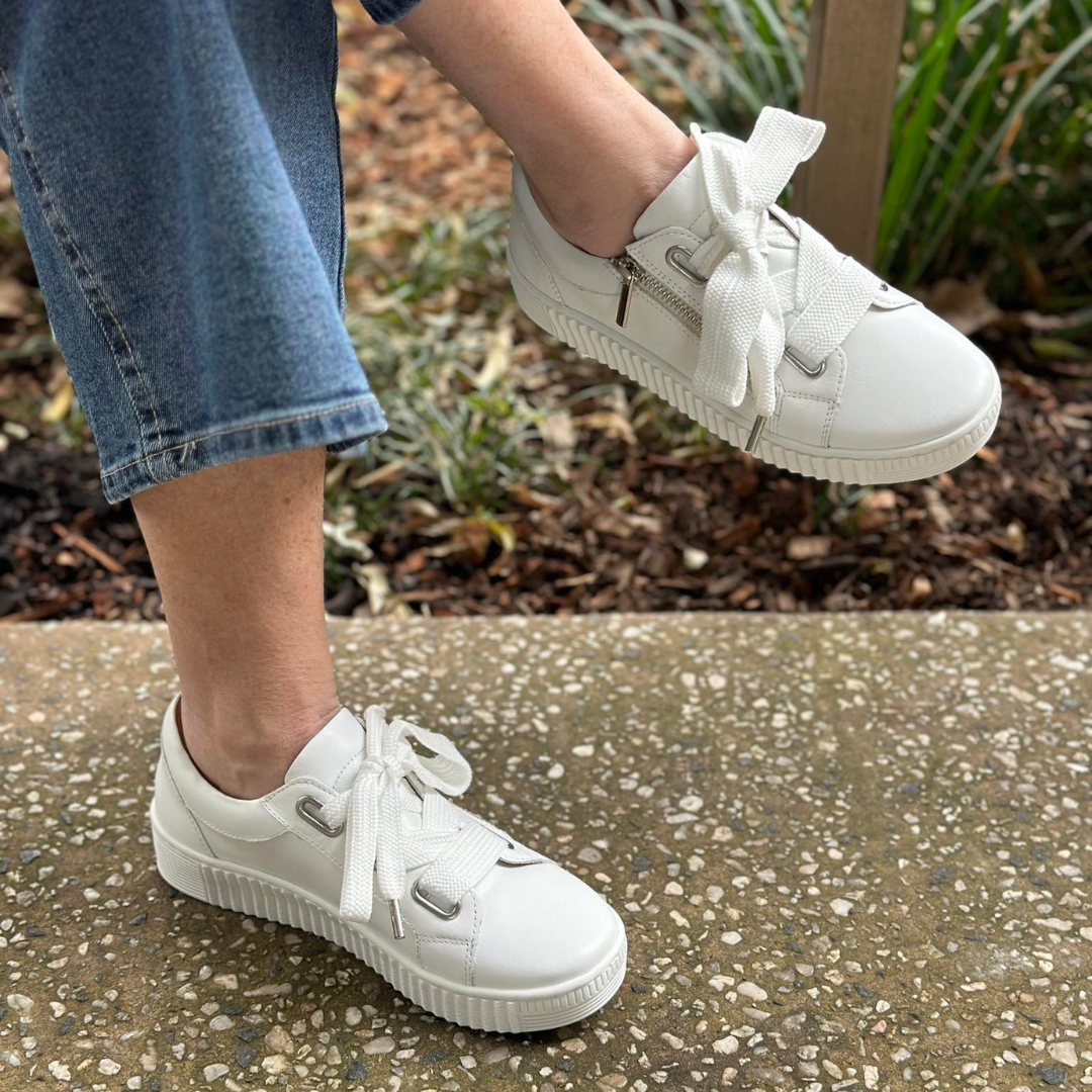 white sneaker with thick white lace side zip