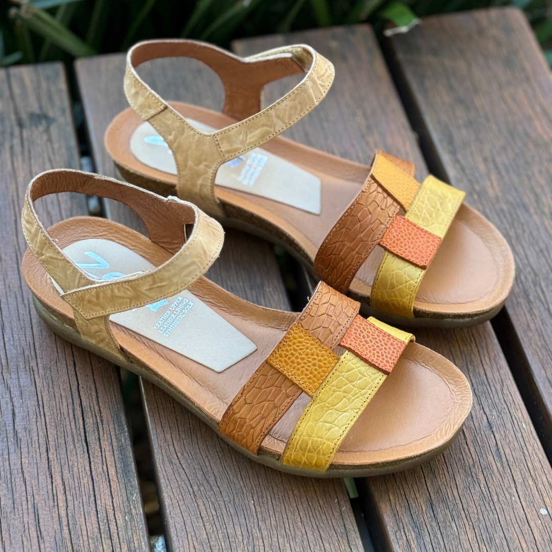 beige multi coloured earty toned sandals with velcro straps
