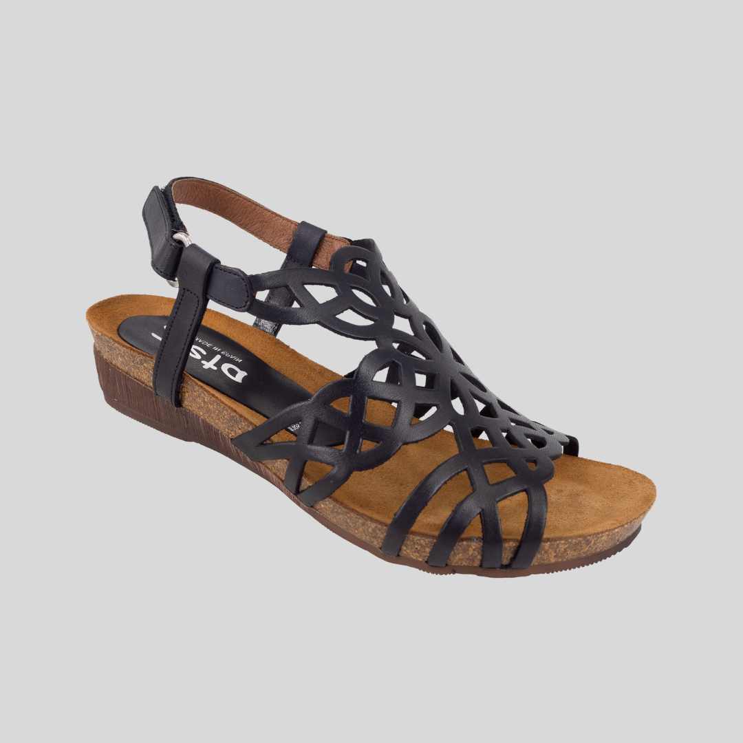 Black low wedge sandals by Zeta. Velcro strap at heel