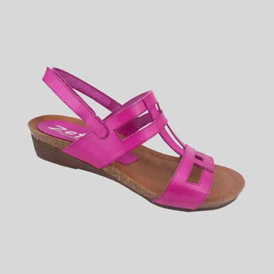 Pink low wedge sandals with velcro strap at heel